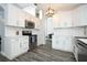 Well-equipped kitchen with stainless steel appliances, white cabinets, and ample counter space at 759 Lake Como Dr, Lake Mary, FL 32746