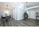 Open-concept living space featuring modern flooring, dining area, and stylish decor at 759 Lake Como Dr, Lake Mary, FL 32746