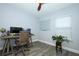 Office featuring a modern desk setup, large monitor, and a window for natural light at 759 Lake Como Dr, Lake Mary, FL 32746