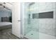 Updated walk-in shower features modern fixtures and marble tiling in the ensuite bathroom at 759 Lake Como Dr, Lake Mary, FL 32746