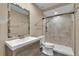 Bathroom with modern sink vanity, mosaic mirror and step-in shower with updated shower fixture at 845 Valnera Ct, Kissimmee, FL 34758