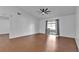 Bright and spacious bedroom with vaulted ceiling, wood floors, and sliding glass doors to patio at 845 Valnera Ct, Kissimmee, FL 34758
