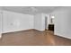 Bright bedroom featuring hardwood floors, ceiling fan, and adjoining bathroom for added convenience at 845 Valnera Ct, Kissimmee, FL 34758