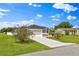 Charming home featuring a well-manicured lawn and a two-car garage at 845 Valnera Ct, Kissimmee, FL 34758