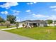 Charming single-story home featuring a well-manicured lawn, mature trees, and an inviting curb appeal at 845 Valnera Ct, Kissimmee, FL 34758