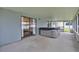 Covered patio with a hot tub and sliding glass door access to the home at 845 Valnera Ct, Kissimmee, FL 34758