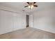 Bedroom featuring neutral carpet, a ceiling fan, and double doors to a closet at 879 Tamerlane St, Deltona, FL 32725