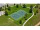 An aerial view of a basketball and soccer court on a well-manicured green field at 8951 Hilton Ridge Ave, Kissimmee, FL 34747