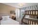 Bright bedroom featuring a twin bed and a bunk bed with stylish zebra-striped accent wall at 8951 Hilton Ridge Ave, Kissimmee, FL 34747