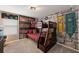A charming bedroom featuring custom bunk beds and themed wallpaper at 8951 Hilton Ridge Ave, Kissimmee, FL 34747
