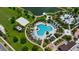 Overhead view of community pool, volleyball court, cabanas, and ample seating for residents at 8951 Hilton Ridge Ave, Kissimmee, FL 34747