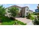 Charming two-story home with a stone facade, paved driveway, and well-maintained landscaping at 8951 Hilton Ridge Ave, Kissimmee, FL 34747