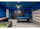 Fun game room featuring a pool table, foosball, and air hockey with vibrant, themed decor at 8951 Hilton Ridge Ave, Kissimmee, FL 34747