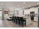 Bright eat-in kitchen with a large island, stainless steel appliances, and modern white cabinetry at 8951 Hilton Ridge Ave, Kissimmee, FL 34747