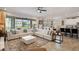 Bright living space with comfortable sectional sofa, dining table, and open-concept kitchen at 8951 Hilton Ridge Ave, Kissimmee, FL 34747