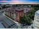 Stunning aerial view of the complex showcasing its unique architecture and vibrant surroundings at sunset at 911 N Orange Ave # 443, Orlando, FL 32801