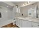 Clean bathroom with white vanity, bath tub and shower featuring wood look floors at 911 N Orange Ave # 443, Orlando, FL 32801