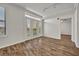 Bright living room featuring wood floors, french doors to balcony and neutral paint scheme at 911 N Orange Ave # 443, Orlando, FL 32801