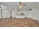 Open-concept living room showing breakfast bar, white doors, and wood flooring at 911 N Orange Ave # 443, Orlando, FL 32801