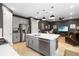 Open concept kitchen with stainless steel appliances, a large island, and a view of the living room at 971 Braewood Dr, Clermont, FL 34715