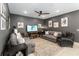 Spacious living room with stylish decor, a ceiling fan, and plenty of seating at 971 Braewood Dr, Clermont, FL 34715