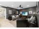 Spacious living room features comfortable seating, neutral decor, and modern lighting fixtures at 971 Braewood Dr, Clermont, FL 34715
