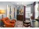 Charming home office features modern lighting, artwork, and a comfortable leather chair at 971 Braewood Dr, Clermont, FL 34715