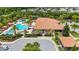 Aerial view of the pool, outdoor lounge area, and community center at 971 Braewood Dr, Clermont, FL 34715