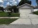 Charming single-Gathering home features a well-maintained lawn and a two-car garage, complete with an ADT security system at 10712 Fairhaven Way, Orlando, FL 32825
