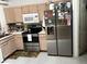 Well-appointed kitchen features stainless steel appliances, ample cabinet space, and a built-in microwave at 10712 Fairhaven Way, Orlando, FL 32825