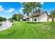 Well-maintained backyard with lake view and mature landscaping at 11548 Pumpkin Seed Ct, Orlando, FL 32821