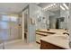 Bathroom featuring a double vanity, tiled floor, and glass enclosed shower at 11548 Pumpkin Seed Ct, Orlando, FL 32821
