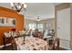 Elegant dining area connected to the living room, perfect for hosting gatherings and enjoying meals at 11548 Pumpkin Seed Ct, Orlando, FL 32821