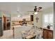Bright kitchen area featuring white cabinets, a breakfast nook, and modern appliances, ideal for culinary enthusiasts at 11548 Pumpkin Seed Ct, Orlando, FL 32821