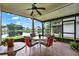 Enjoy the lanai with a ceiling fan and a beautiful lake view at 11548 Pumpkin Seed Ct, Orlando, FL 32821