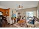 Bright living room with sliding glass doors, hardwood floors, and ample seating for relaxation and entertainment at 11548 Pumpkin Seed Ct, Orlando, FL 32821