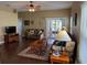 Inviting living room featuring a ceiling fan, sliding glass doors to lanai, and comfortable seating arrangement at 11548 Pumpkin Seed Ct, Orlando, FL 32821