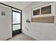 Mud room with white walls, a window and a door leading to the outside at 11548 Pumpkin Seed Ct, Orlando, FL 32821