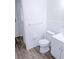 White bathroom featuring clean tile, updated toilet, and sleek fixtures; a relaxing space for personal care at 1200 Ne 45Th Pl, Ocala, FL 34479