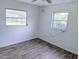 An airy bedroom offers updated floors, neutral walls, and natural light at 1200 Ne 45Th Pl, Ocala, FL 34479
