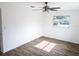 Inviting bedroom featuring a ceiling fan, bright window, and modern wood-look flooring at 1200 Ne 45Th Pl, Ocala, FL 34479