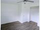 A bedroom offers new flooring, fresh paint, and an ample closet at 1200 Ne 45Th Pl, Ocala, FL 34479