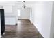 Open dining room space with view to kitchen and adjacent rooms, featuring gray flooring at 1200 Ne 45Th Pl, Ocala, FL 34479