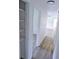 A hallway featuring modern flooring and access to other rooms at 1200 Ne 45Th Pl, Ocala, FL 34479