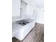 Kitchen sink with double basin, white cabinets, and gray countertops; open layout ideal for entertaining at 1200 Ne 45Th Pl, Ocala, FL 34479