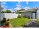 Landscaped backyard featuring mature plants and a partial privacy fence at 1615 Wilson Ave, Orlando, FL 32804