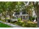 Attractive two-story home with a black balcony and a manicured lawn, creating a welcoming curb appeal at 1615 Wilson Ave, Orlando, FL 32804
