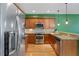 Well-equipped kitchen with stainless steel appliances, granite countertops, and stylish cabinetry at 1615 Wilson Ave, Orlando, FL 32804