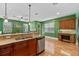 Open kitchen with granite countertops, stainless steel appliances, and hardwood floors at 1615 Wilson Ave, Orlando, FL 32804