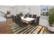 Bright dining room with modern table, seating for eight, and natural light at 1878 Seawall Way, Celebration, FL 34747